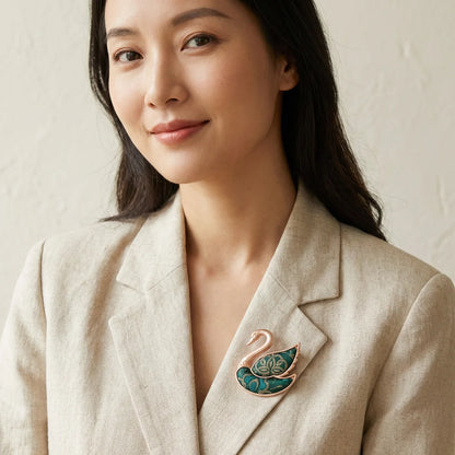 Emerald Green Shu Brocade Swan Brooch lifestyle worn on lapel — portrait styled