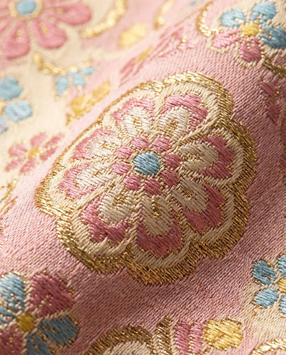 Shu Brocade texture close-up — pink silk weave detail hand-loomed Chengdu artisan