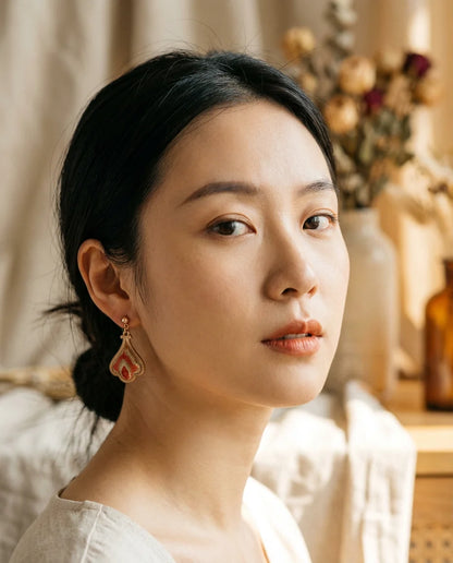 Teardrop Terracotta Shu Brocade Drop Earrings worn — close-up lifestyle portrait