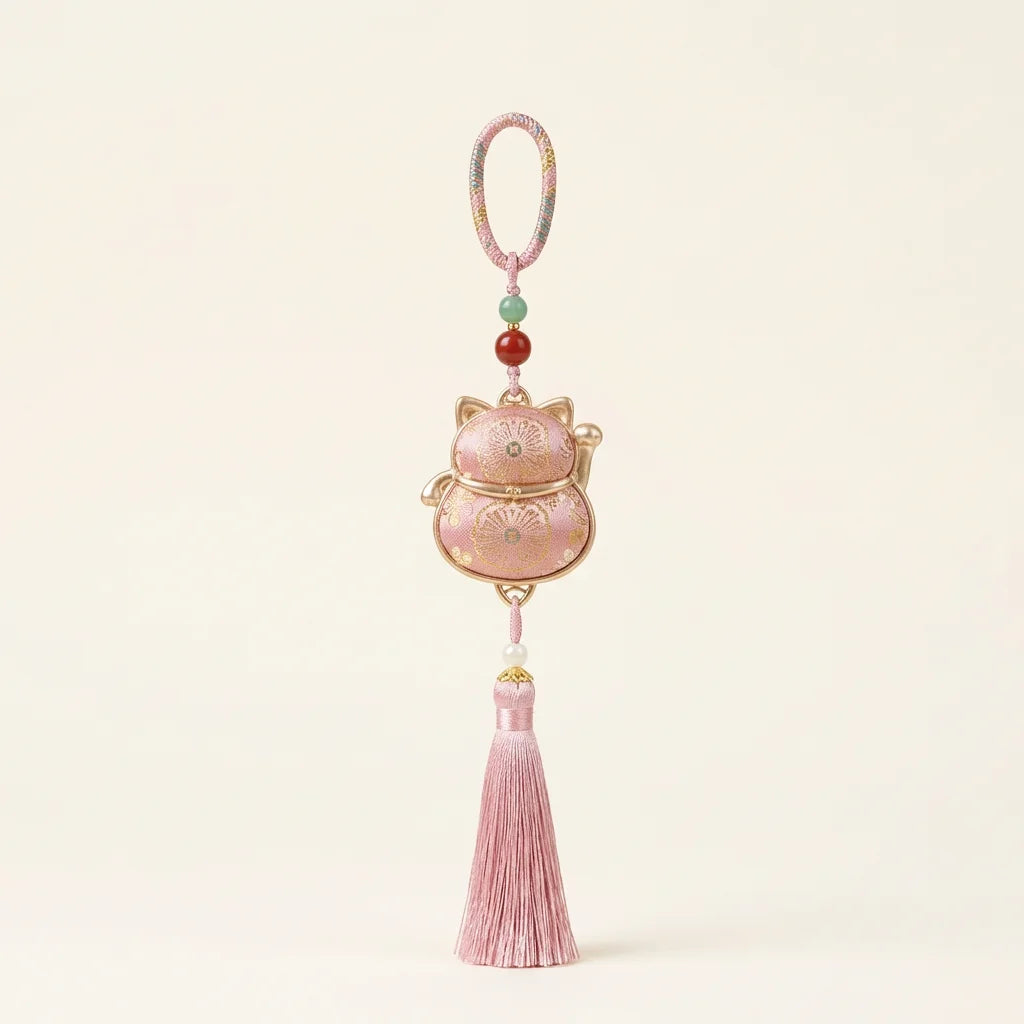Pink Lucky Cat Fortune Knot Tassel Charm — ivory background HERO handcrafted