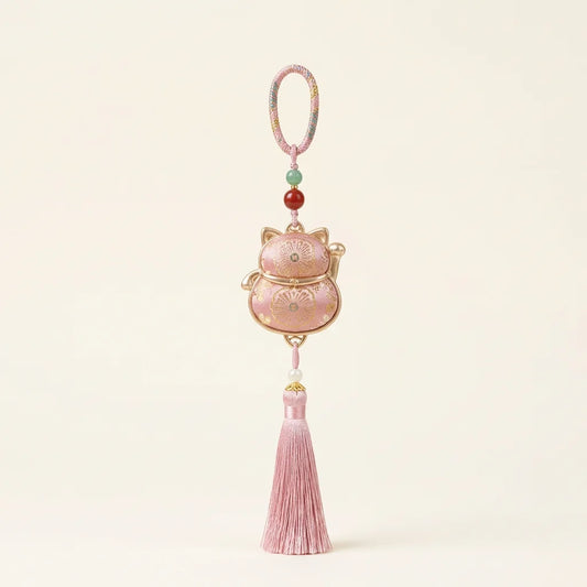 Pink Lucky Cat Fortune Knot Tassel Charm — ivory background HERO handcrafted
