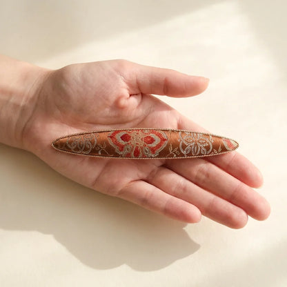 Elongated boat barrette size reference — hand scale approximately 10cm Shu Brocade