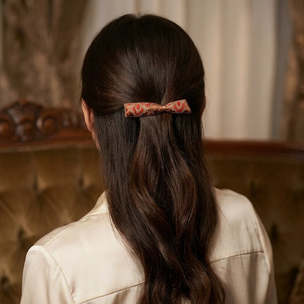 Bow Silk Brocade Hair Clip — Terracotta worn in hair SCENE lifestyle